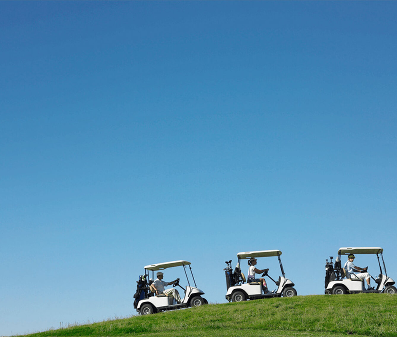 Golfers driving a cart